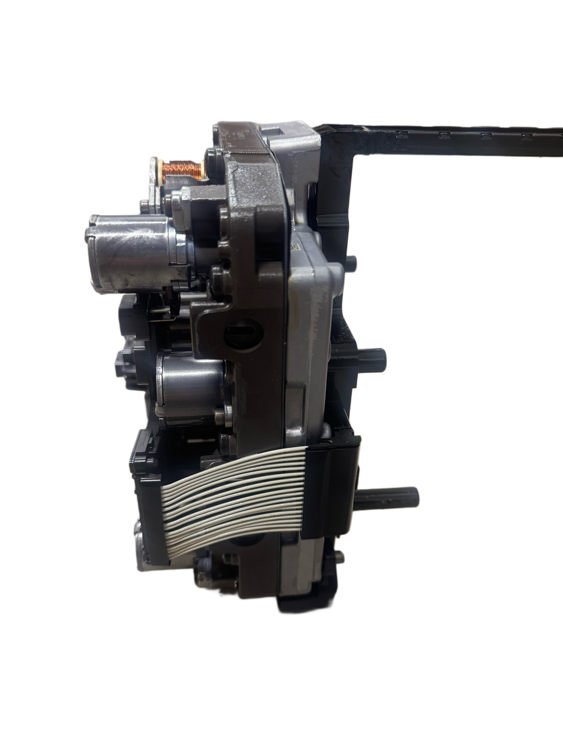 02E927770AL mechatronics side view displaying aluminum valve body housing with hydraulic cooling fins and solenoid valves