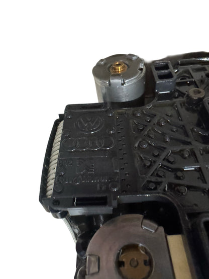 DSG DQ250 mechatronics detail view showing pressure regulator valve and TEMIC control unit circuit board assembly